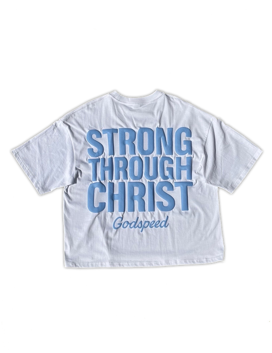White t-shirt with blue text 'STRONG THROUGH CHRIST' on a white background